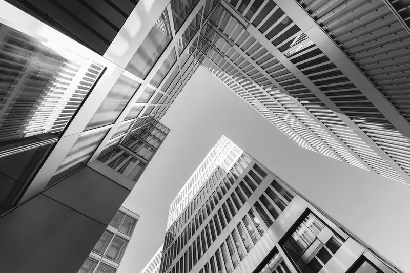 Office buildings in black and white, seen from below