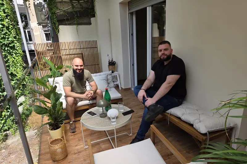 Two colleagues talking in the lounge of our office