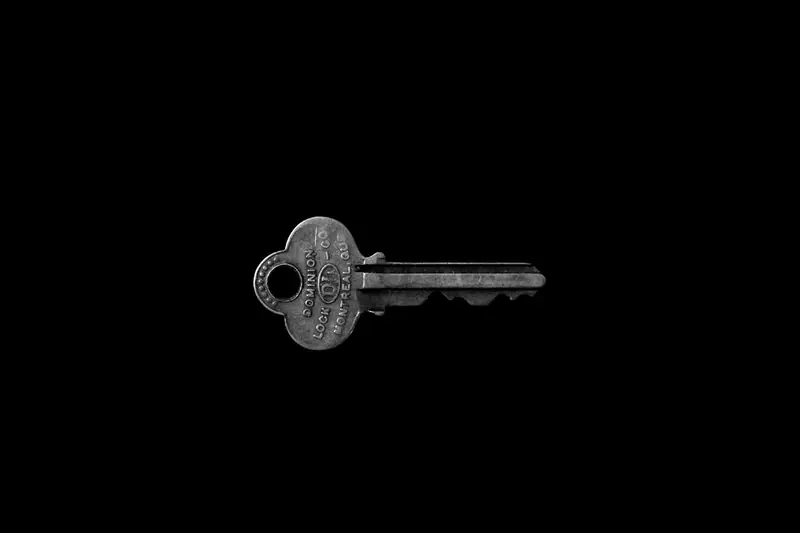 A key on a black surface