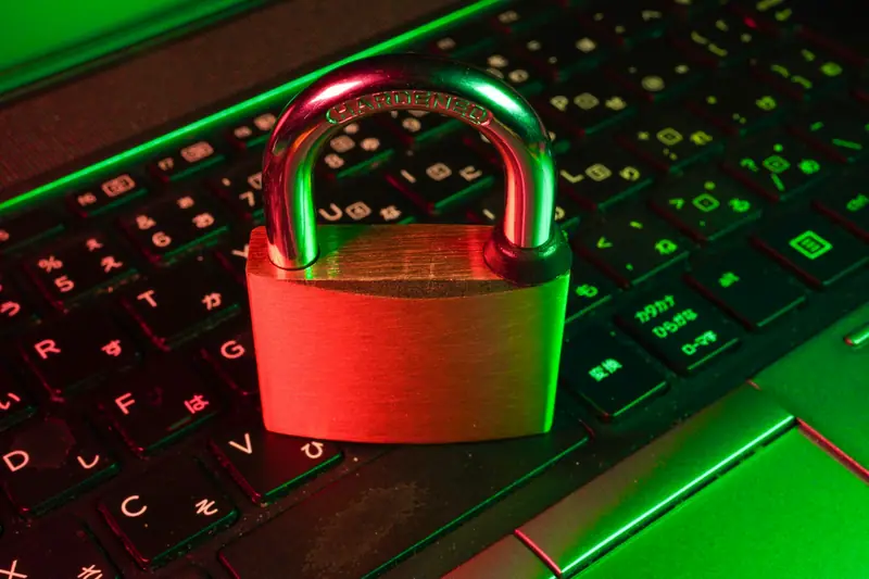 A padlock on a backlit laptop keyboard